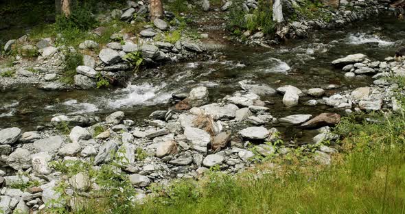 Wild Mountain River Flowing Through Stone Boulders