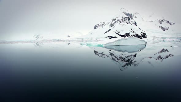 Sailing past icebergs in Antarctica