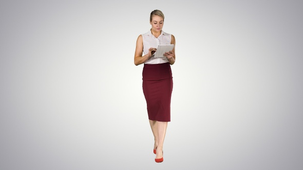 Young professional business woman using tablet computer