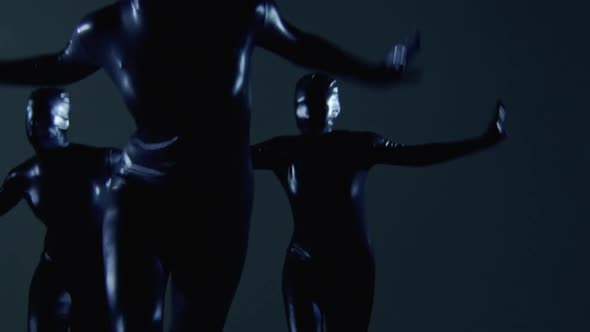 Close Shot of Three Female Dancers in Black Latex