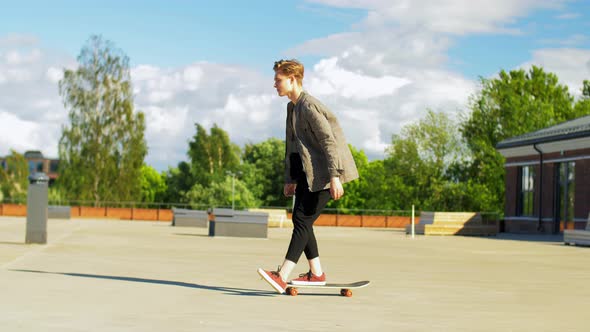 Young Man or Teenage Boy on Skateboard on Roof Top