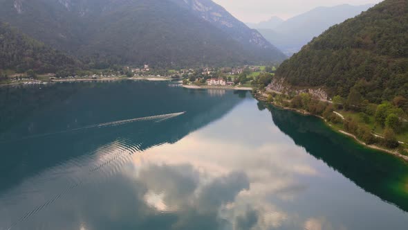Aerial view of Ledro lake, Trentino, Val di Ledro in North Italy. Drone goes up