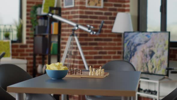 Empty Interior with Chess Board Game and Chips on Table