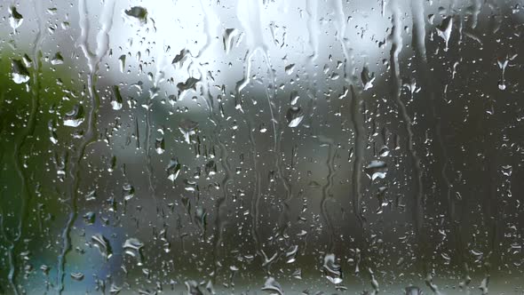 Heavy Rain Drops On Window Glass