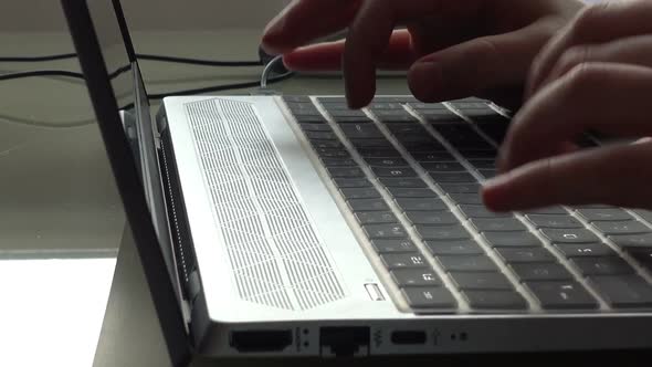 The girl working at home office hands on keyboard.