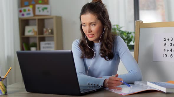 Math Teacher Having Online Class on Laptop at Home