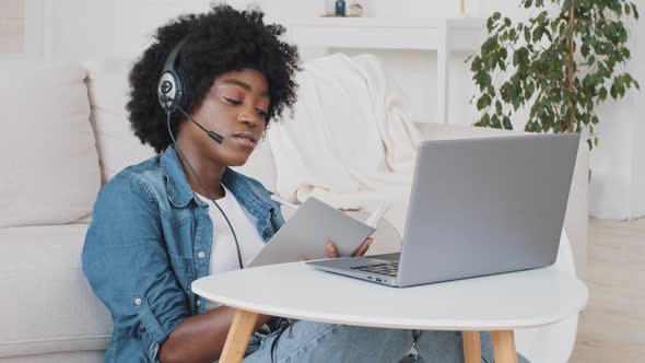 Young African American Smart Girl Student Wearing Headset Elearning By Webcam