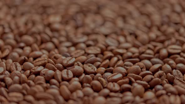 Full Frame Looped Spinning Background of Roasted Coffee Beans