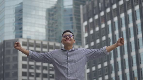 Portrait handsome Asian businessman after a working have success and achievement.