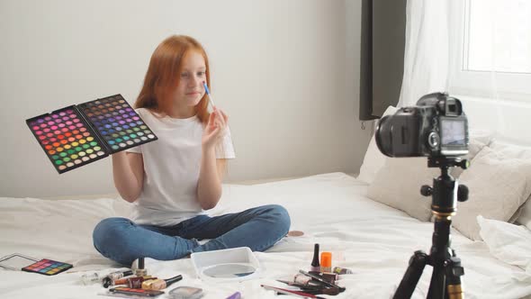 Redheaded Young Girl Sits in Front of the Camera and Talks About Cosmetic Products That Are Allowed