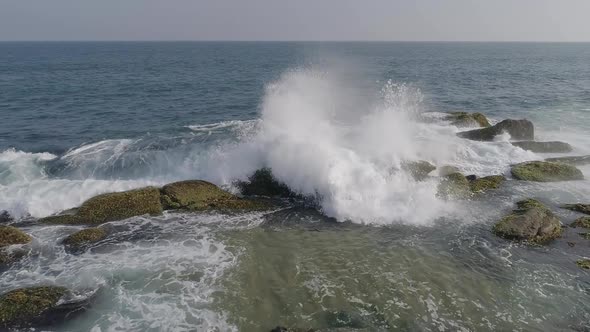 Wave Crashing On Rock Beach