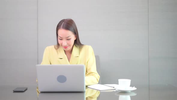 Young asian woman use laptop