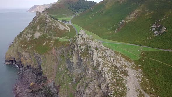 Wide aerial tracking from left to right reveals the amazing scenery at the Valley of Rocks on Exmoor