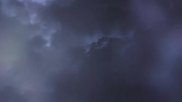 Stormy night sky with flashes of lightning