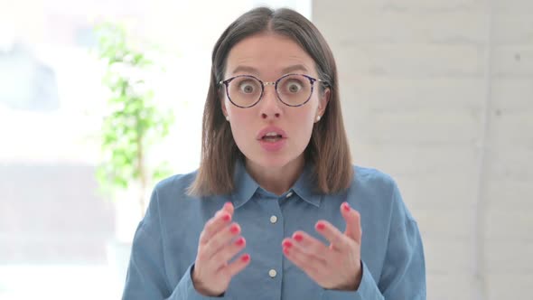 Portrait of Young Woman feeling Shocked