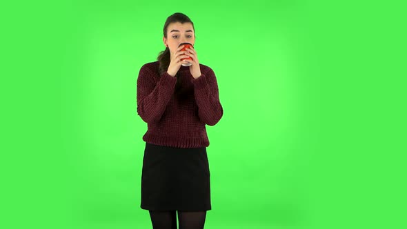 Girl Drinks Unpalatable Coffee and Is Disgusted on Green Screen.