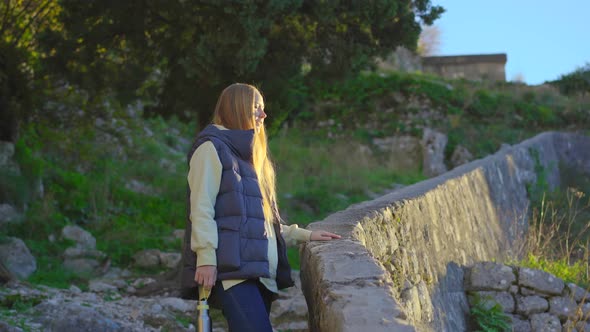 A Woman and Ger Son Visit the Old Town of Kotor in Montenegro