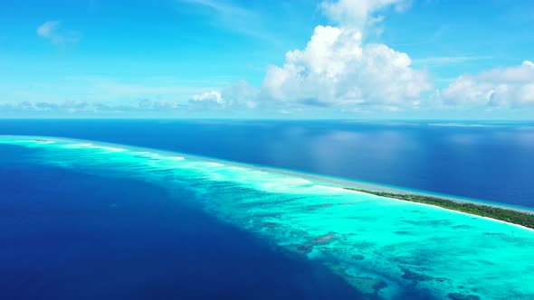 Tropical birds eye abstract view of a sunshine white sandy paradise beach and aqua blue water backgr