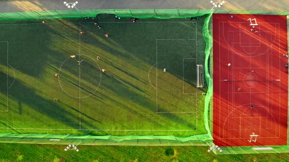 Top down view of sports field with footballers playing in Poland