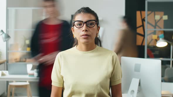 Time Lapse of Hispanic Businesswoman Posing in Office