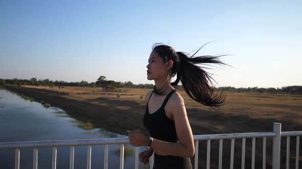 Young women exercise by running