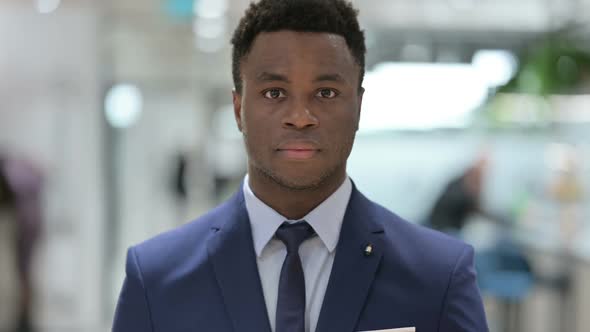 Portrait of Serious African Businessman Looking at the Camera