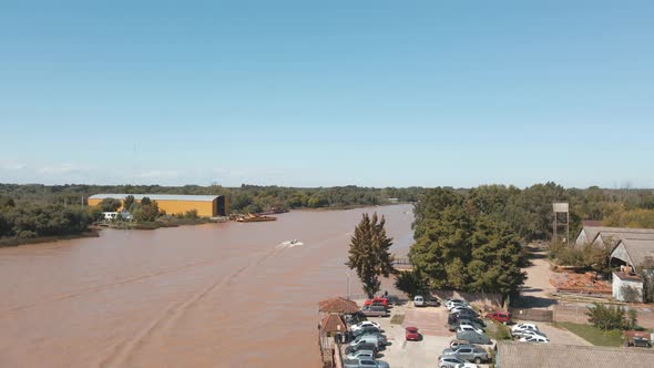 Lujan River With Brown Muddy Water At Daytime In Buenos Aires, Argentina. - aerial