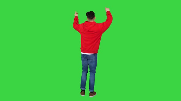 Casual Man Dancing in a Red Hoody on a Green Screen, Chroma Key
