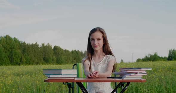 Schoolgirl at Desk Surrounded By Nature