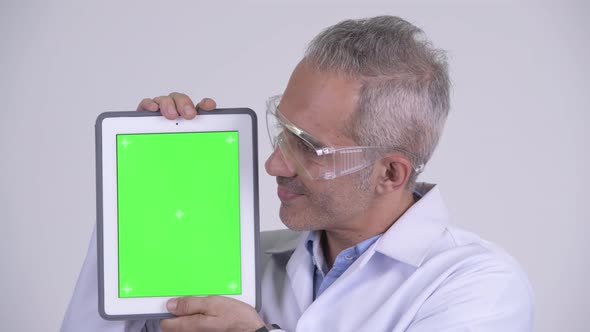 Happy Persian Man Scientist Showing Digital Tablet