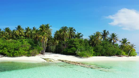 Luxury drone travel shot of a white sand paradise beach and blue sea background in high resolution 