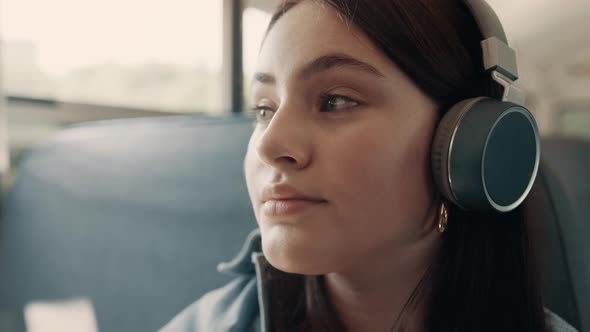 Closeup Thoughtful Girl Face with Headphones