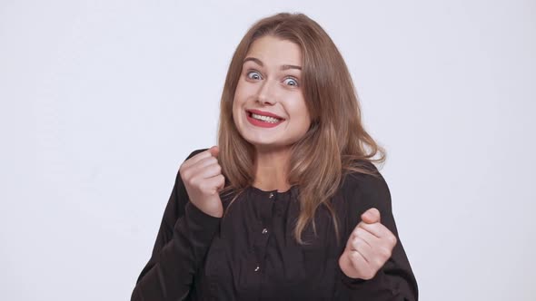 Young Beautiful Surprised Excited Fairhaired Girl Over White Background Slow Motion