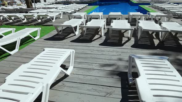 Empty Deckchair Near Swimming Pool