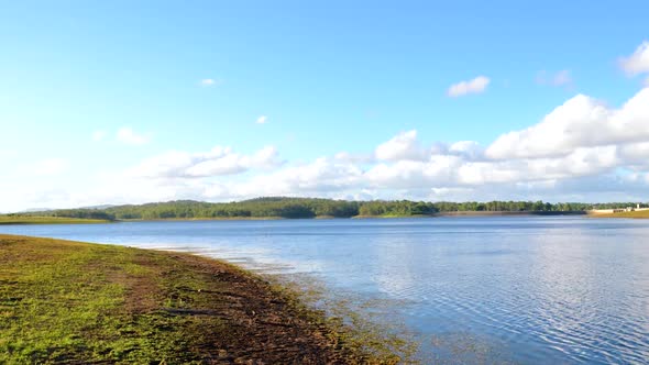 Majestic time-lapse of lake with Dam in the distance