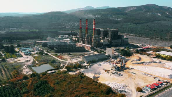 Aerial View of Industrial Chimney of Nuclear Power Plant on Nature Landscape