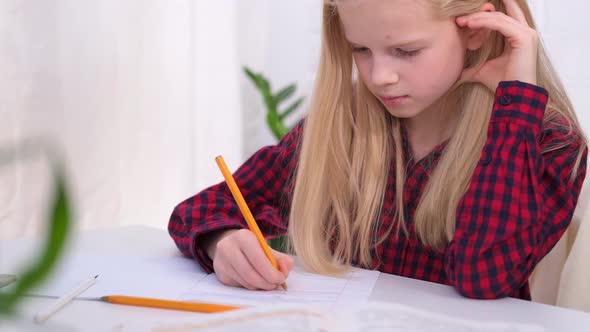 Blonde Schoolgirl Studying at Home Doing School Homework