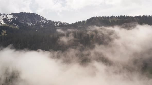 Jib up over clouds in beautiful mountain area