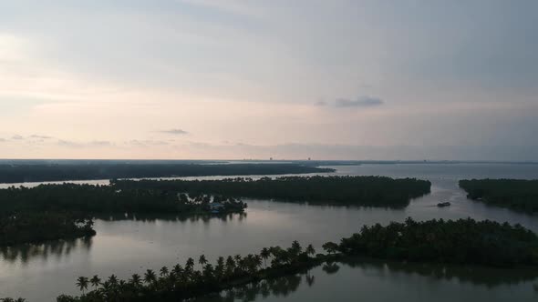 Beautiful aerial shot of a backwater island,Vembanad lake Asia,Boat cruise,Sunset