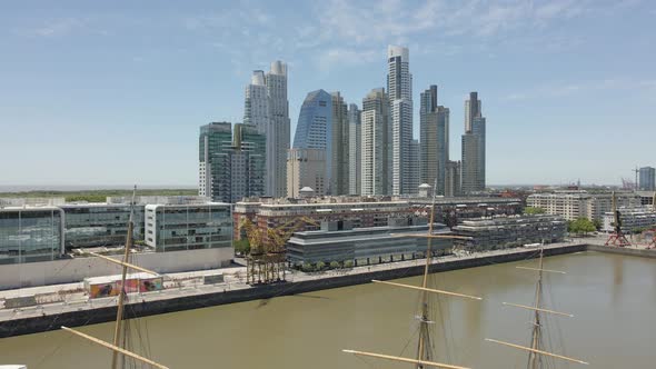 High Rise Buildings By The River In Puerto Madero, Buenos Aires, Argentina - ascending wide shot