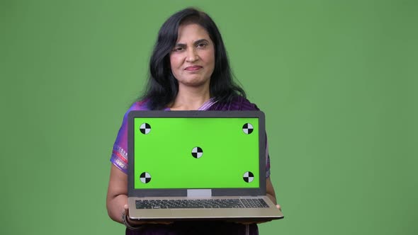 Mature Beautiful Indian Woman Showing Laptop