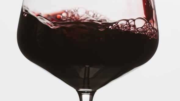 Sommelier Pouring an Excellent Red Wine in Glass. Rose Wine Pour Into Glass.