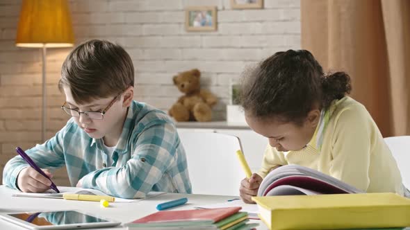 Kids Drawing at Desk