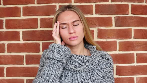 Headache Upset Tense Woman in Loft Office