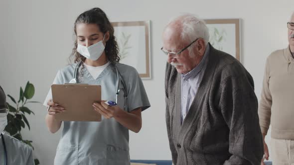 Seniors Getting Medical Assistance at Nursing Home