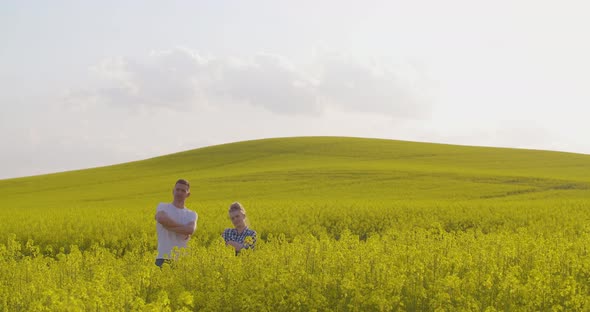 Two Farmers Working on Field Agriculture