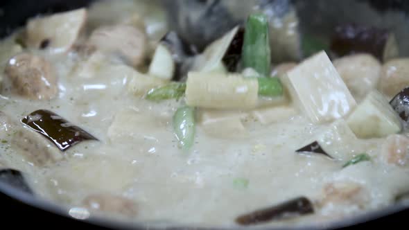 Slowly Stir of Thai Vegan Vegetable Curry in Coconut Milk - Close Up