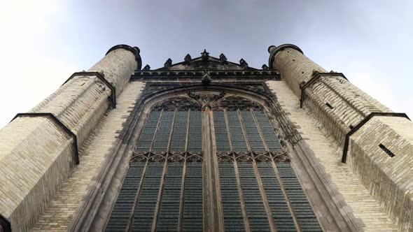 Bottom up timelapse shot of old town Marekerk Church in Leiden City during cloudy da,Netherlands.