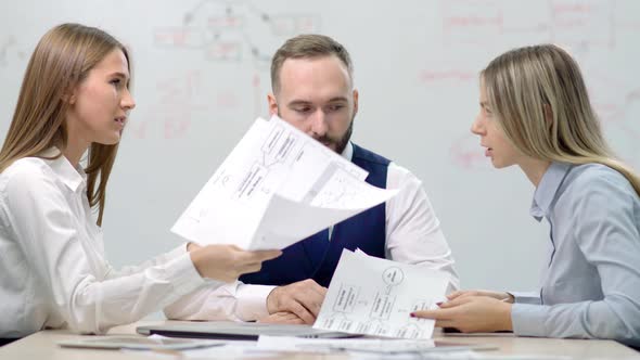 Two Young Disgruntled Businesswoman Partners Arguing About Mistake in Document