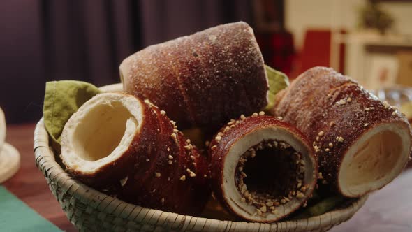 Fresh Baked Trdelnik with Sugar and Nuts in Basket Closeup